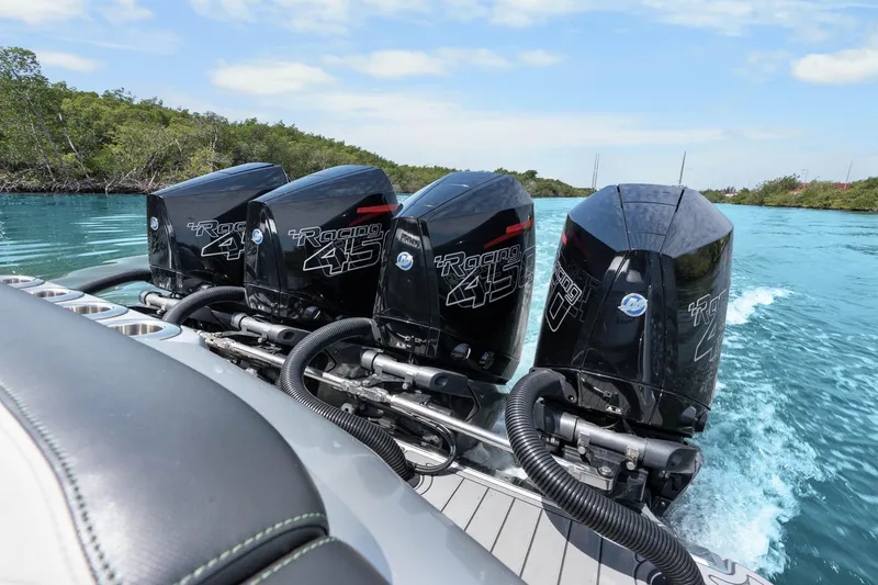Slide: The Image of 2021 Nor-Tech 390 Sport Center Console with quad Mercury Racing 450 engines on blue water. - 22