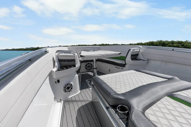 Slide: The Image of 2021 Nor-Tech 390 Sport Center Console boat interior with luxurious seating and modern design. - 27