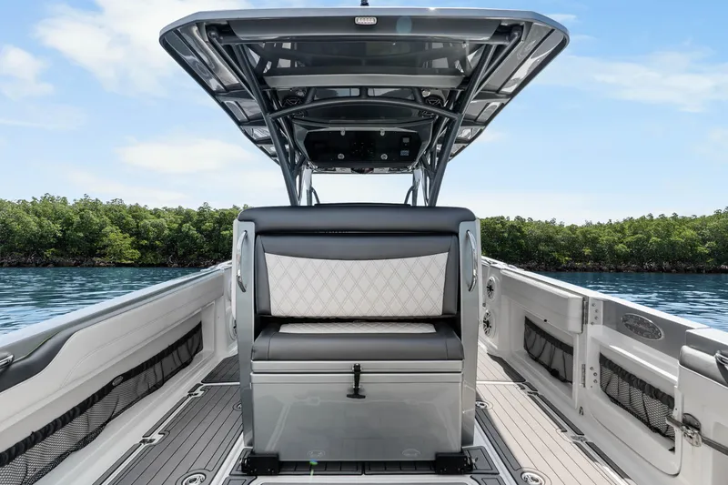 Slide: The Image of 2021 Nor-Tech 390 Sport Center Console boat interior with sleek seating and modern design. - 28