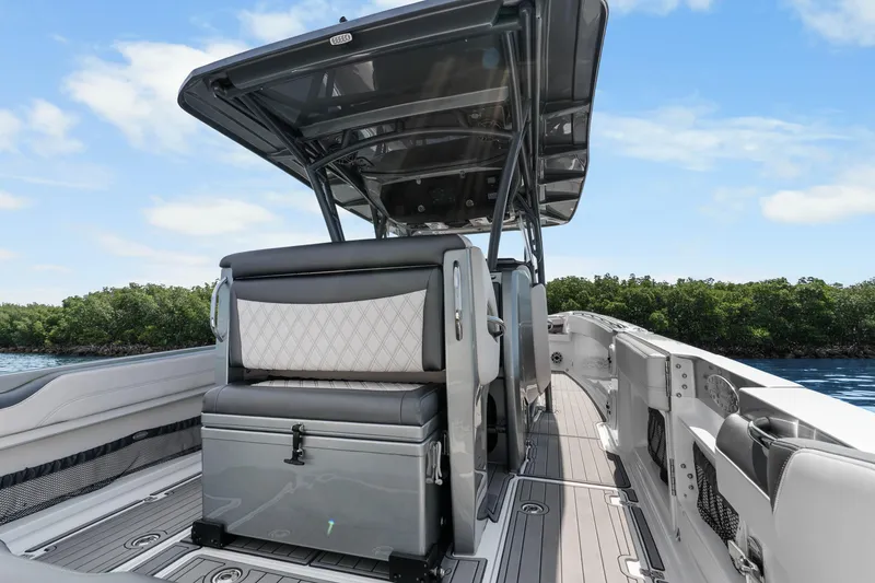 Slide: The Image of 2021 Nor-Tech 390 Sport Center Console boat interior with sleek seating and modern design. - 29