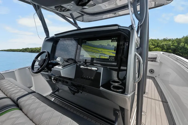 Slide: The Image of 2021 Nor-Tech 390 Sport Center Console interior with advanced navigation system and sleek design. - 30