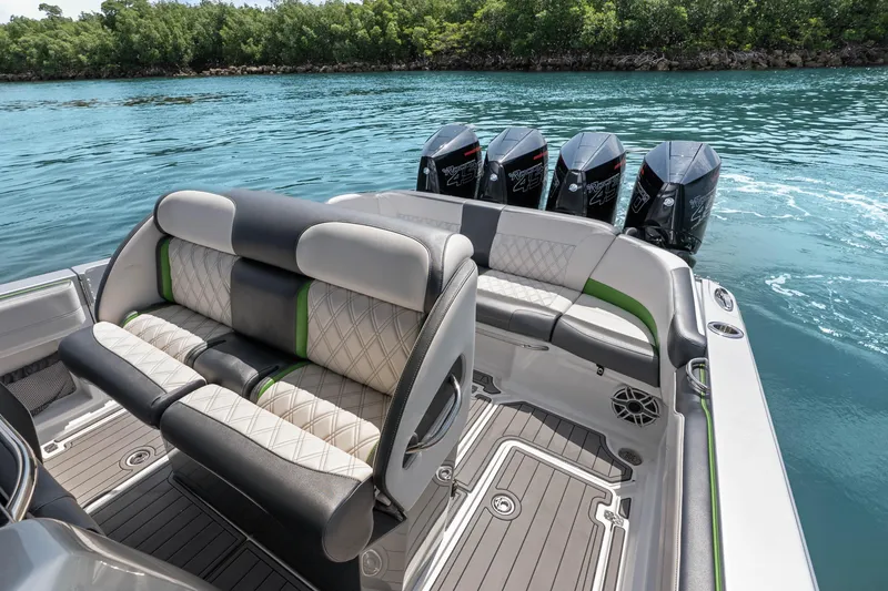 Slide: The Image of 2021 Nor-Tech 390 Sport Center Console with luxurious seating and powerful outboard engines. - 33