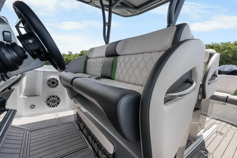 Slide: The Image of 2021 Nor-Tech 390 Sport Center Console interior with luxurious seating and modern design. - 34