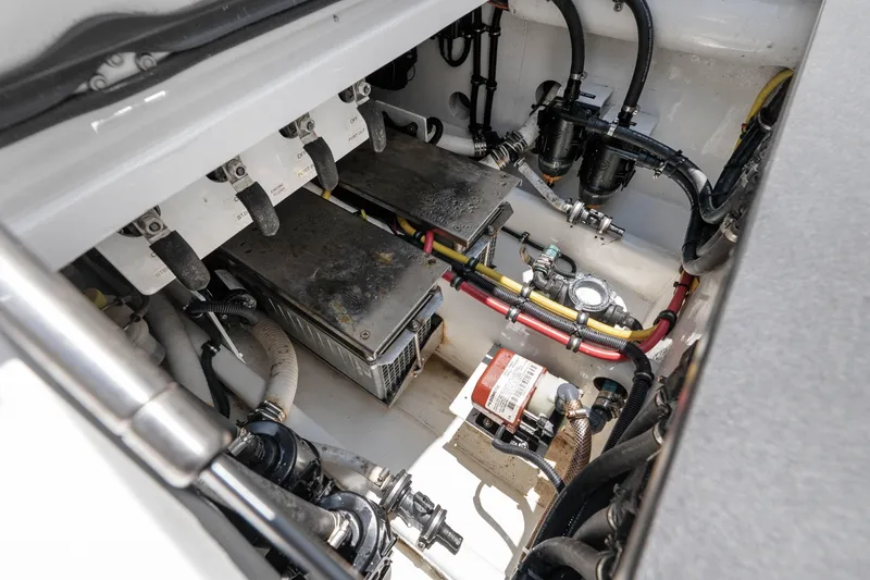 Slide: The Image of Engine compartment of 2021 Nor-Tech 390 Sport Center Console with wiring and components. - 35
