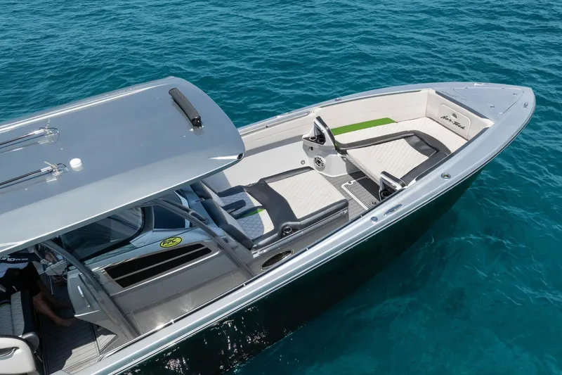 Slide: The Image of 2021 Nor-Tech 390 Sport Center Console boat on clear blue water. - 41