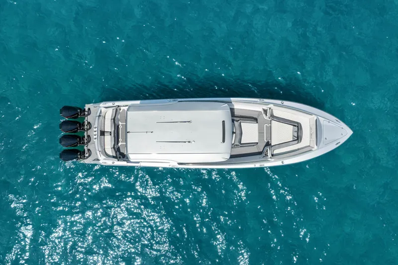 Slide: The Image of Aerial view of 2021 Nor-Tech 390 Sport Center Console on clear blue water. - 42