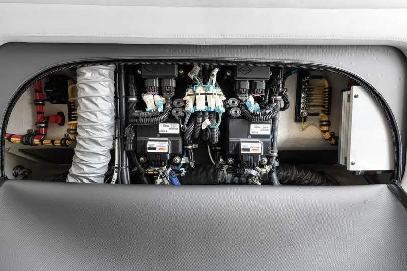 Slide: The Image of Electrical components inside a 2021 Nor-Tech 390 Sport Center Console boat. - 7