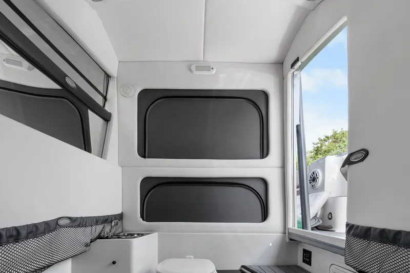 Slide: The Image of Interior of 2021 Nor-Tech 390 Sport Center Console boat, featuring sleek design and modern amenities. - 8