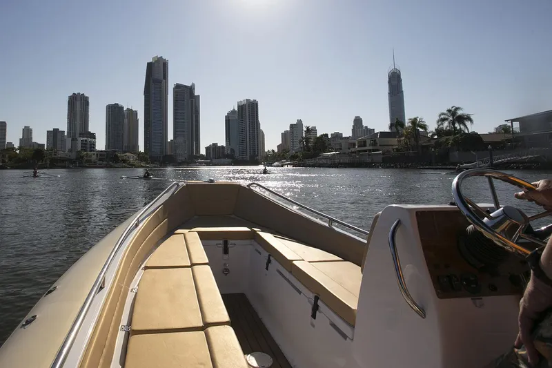 Slide: The Image of Manufacturer Provided Image: AB Inflatables Nautilus 19 DLX 2026 on water with city skyline. - 2