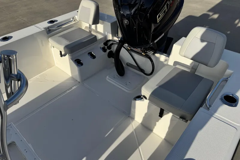 Slide: The Image of Interior of 2026 Bay Rider 2460 FS Skiff with seating and motor. - 13