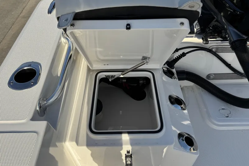 Slide: The Image of Open storage compartment on a 2026 Bay Rider 2460 FS Skiff. - 18