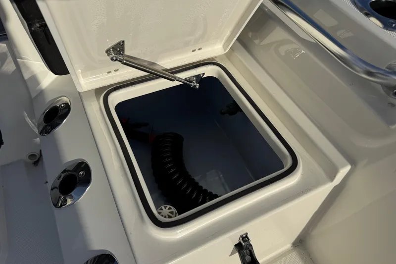 Slide: The Image of Bay Rider 2460 FS Skiff 2026, open storage compartment on boat. - 19