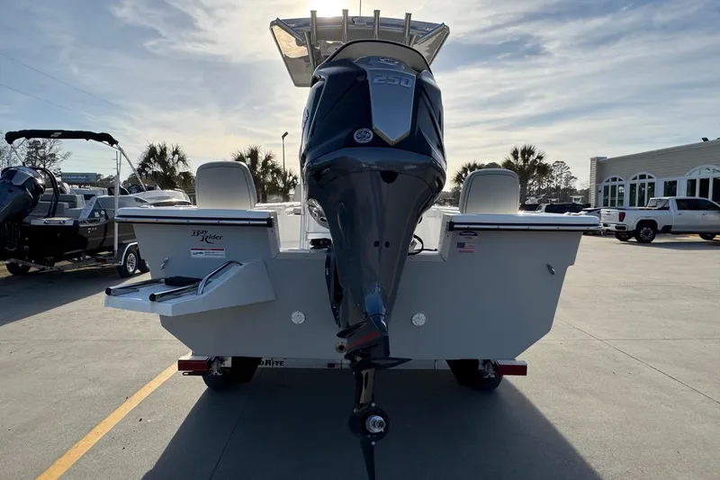 Slide: The Image of Bay Rider 2460 FS Skiff 2026 with outboard motor, parked outdoors. - 3