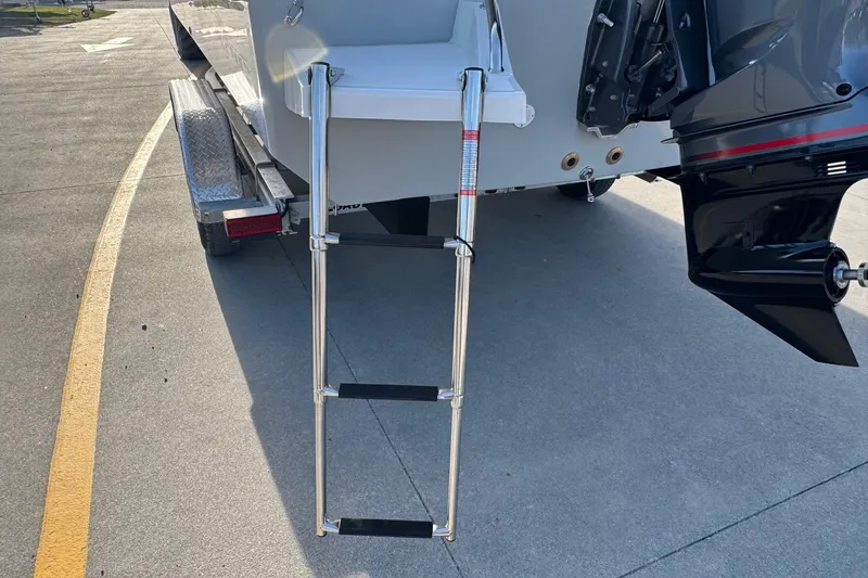 Slide: The Image of Bay Rider 2460 FS Skiff 2026 with retractable ladder at the stern. - 4