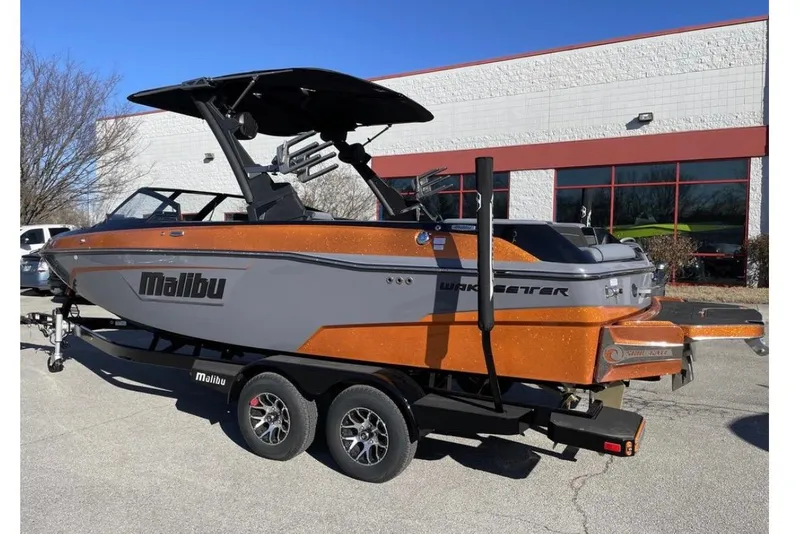 Slide: The Image of 2023 Malibu Wakesetter 23 LSV boat on trailer, parked outdoors. - 6