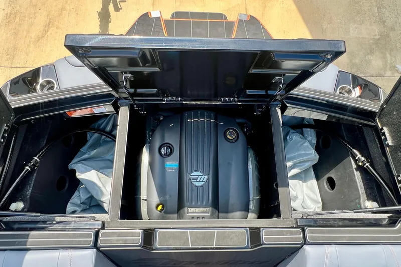 Slide: The Image of 2023 Malibu Wakesetter 23 LSV engine compartment with open hatches, showcasing the engine. - 20