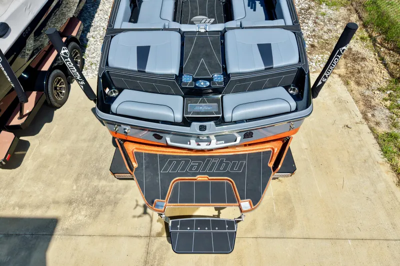 Slide: The Image of 2023 Malibu Wakesetter 23 LSV boat, aerial view, showcasing sleek design and seating. - 2