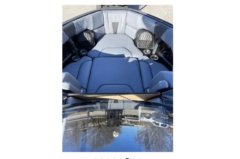 Slide: The Image of 2023 Malibu Wakesetter 23 LSV interior with luxurious seating and cup holders. - 9