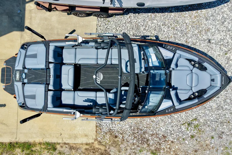 Slide: The Image of The 2023 Malibu Wakesetter 23 LSV features a sleek design with gray upholstery and a spacious layout. - 1