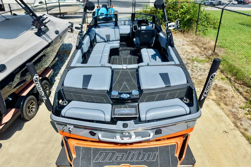 Slide: The Image of The image shows a modern 2023 Malibu Wakesetter 23 LSV boat with gray seating. - 15