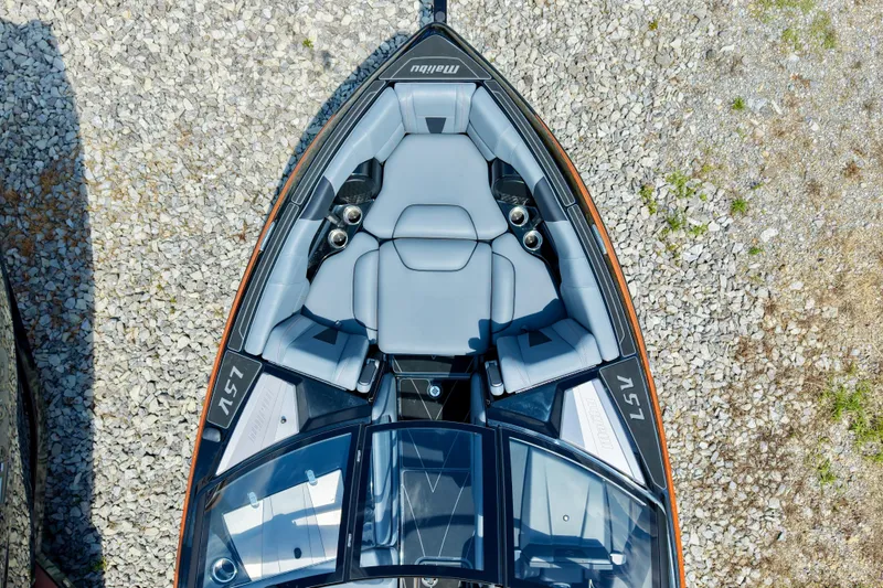 Slide: The Image of 2023 Malibu Wakesetter 23 LSV boat, top view, showcasing sleek seating and design. - 14