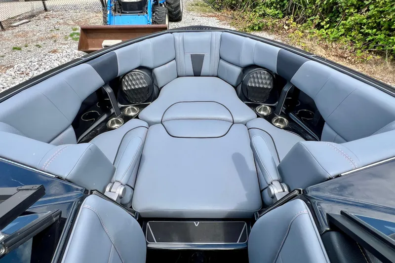 Slide: The Image of 2023 Malibu Wakesetter 23 LSV boat interior with luxurious seating and cup holders. - 6