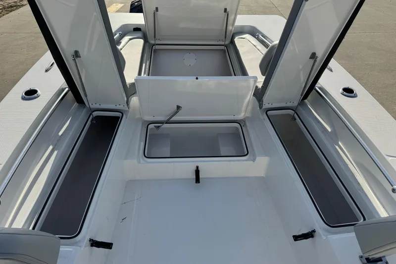 Slide: The Image of Interior view of 2026 Bay Rider 2460 FS Skiff with storage compartments. - 12