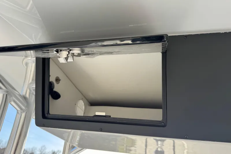 Slide: The Image of Open storage compartment in Bay Rider 2460 FS Skiff 2026. - 16