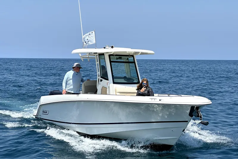 The Image of 2016 Boston Whaler 280 Outrage cruising on open water with two passengers. - 1