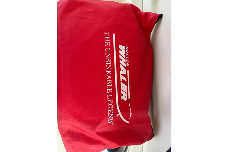 Slide: The Image of Red Boston Whaler bag with "The Unsinkable Legend" text, 2016 model branding. - 4