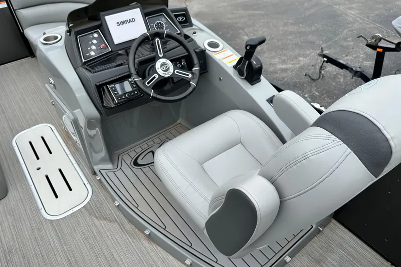 Slide: The Image of 2020 Veranda VTX22RC boat cockpit with steering wheel and Simrad display. - 10