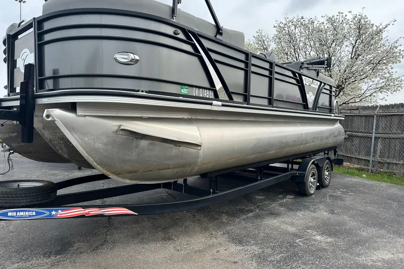 Slide: The Image of 2020 Veranda VTX22RC pontoon boat on trailer, parked near blooming trees. - 4