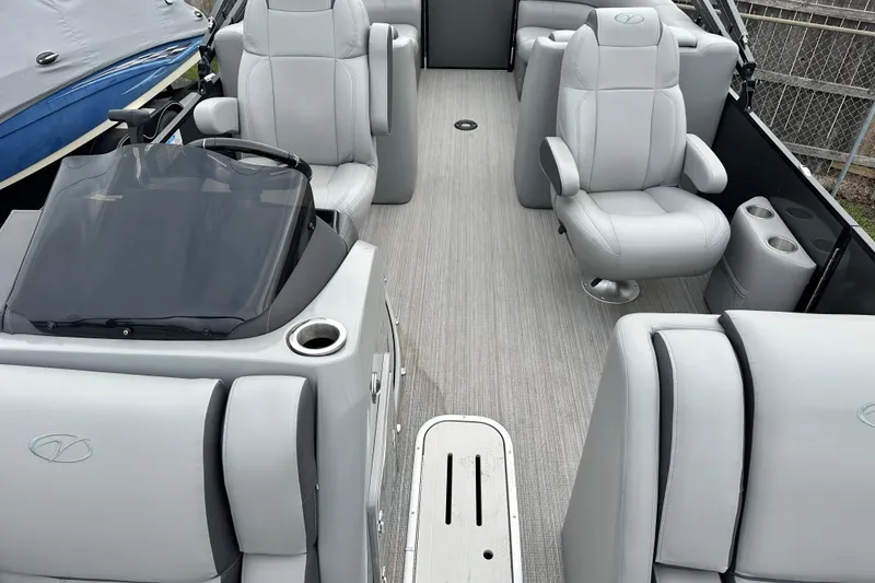 Slide: The Image of 2020 Veranda VTX22RC boat interior with gray seating and steering console. - 6