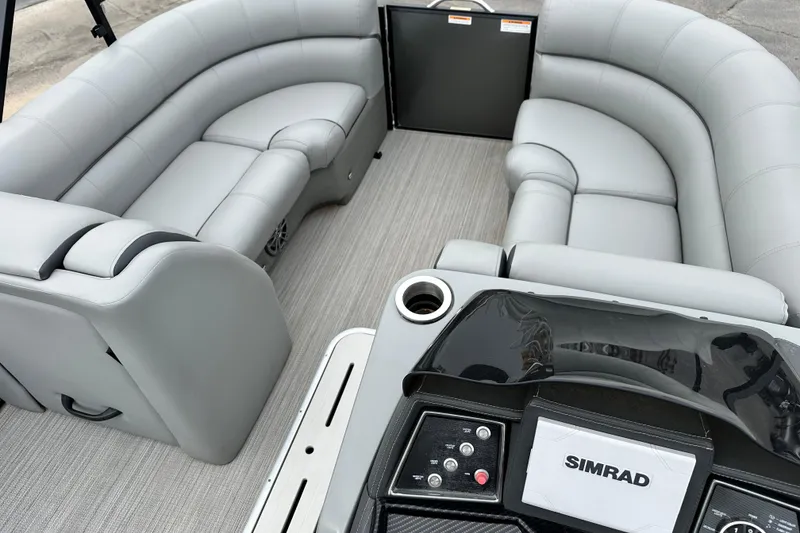 Slide: The Image of 2020 Veranda VTX22RC pontoon boat interior with gray seating and Simrad navigation system. - 9