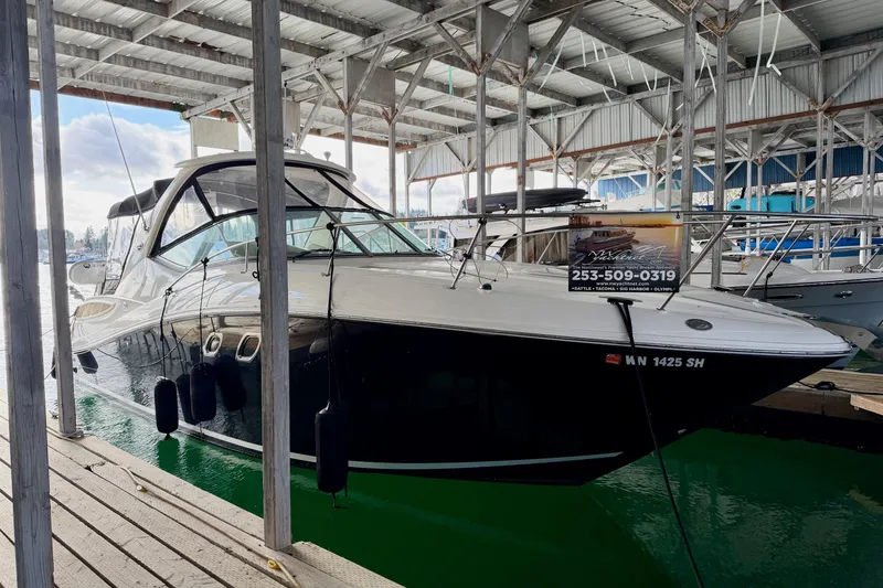 The Image of 2007 Sea Ray Sundancer 310 docked in a covered marina. - 0