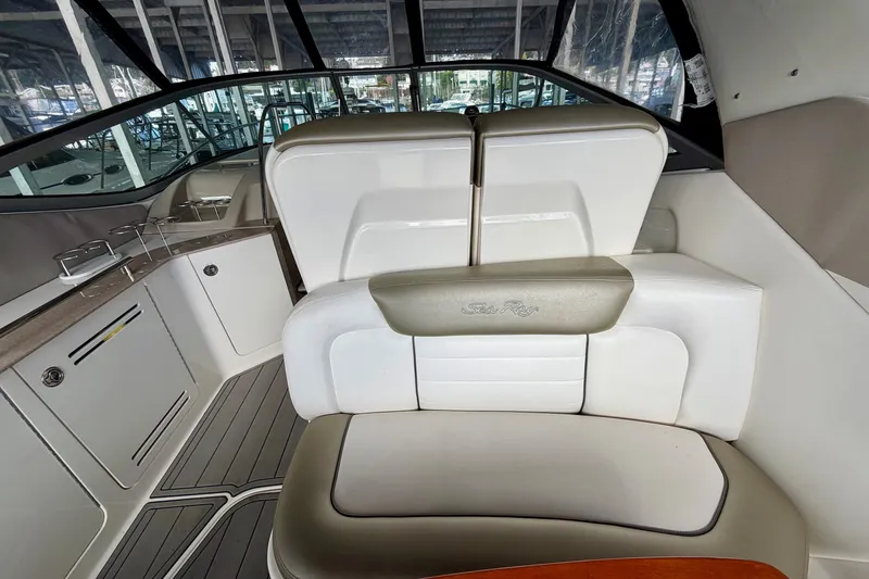 Slide: The Image of 2007 Sea Ray Sundancer 310 interior with white seating and sleek design. - 12