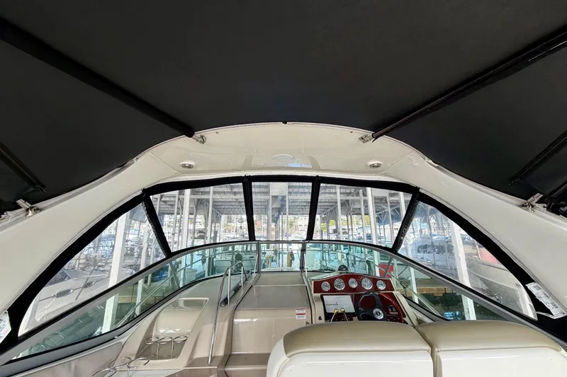 Slide: The Image of Interior view of 2007 Sea Ray Sundancer 310 yacht cockpit with helm and seating. - 13