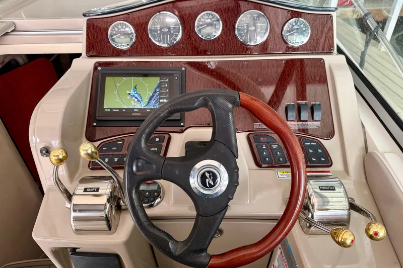 Slide: The Image of 2007 Sea Ray Sundancer 310 helm with GPS, gauges, and controls. - 17