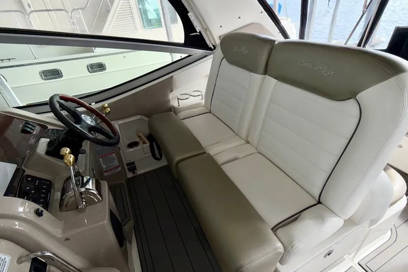 Slide: The Image of 2007 Sea Ray Sundancer 310 helm with dual seats and steering wheel. - 18