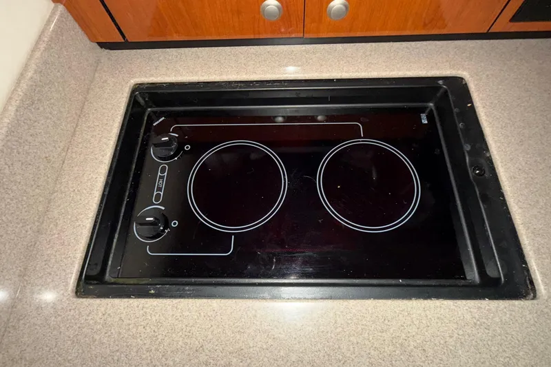 Slide: The Image of Built-in stovetop on 2007 Sea Ray Sundancer 310 yacht kitchen counter. - 22