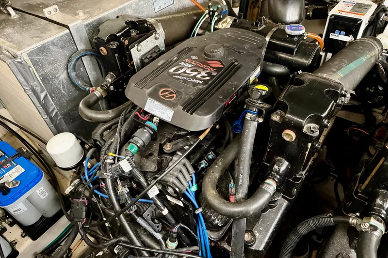 Slide: The Image of Engine compartment of a 2007 Sea Ray Sundancer 310 boat, showcasing detailed components. - 28