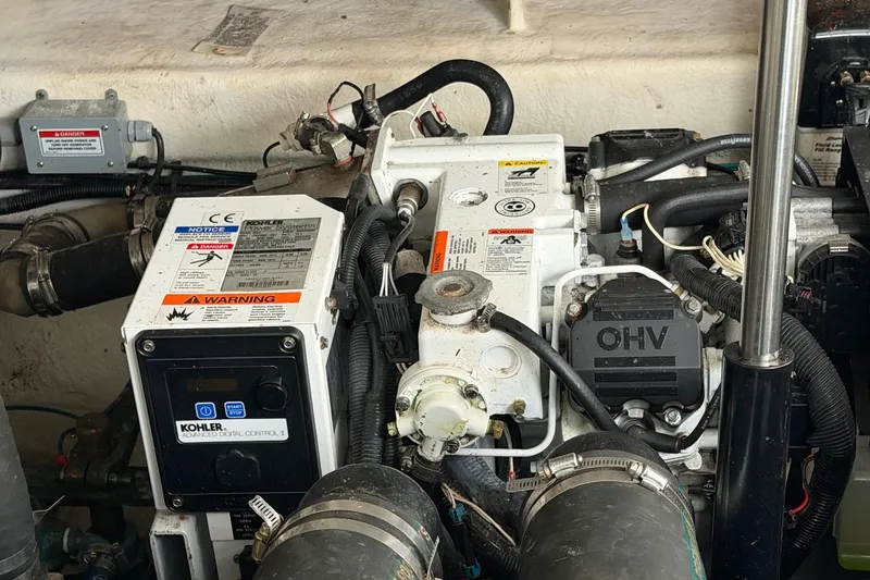 Slide: The Image of Engine compartment of a 2007 Sea Ray Sundancer 310 with Kohler generator and OHV components. - 30