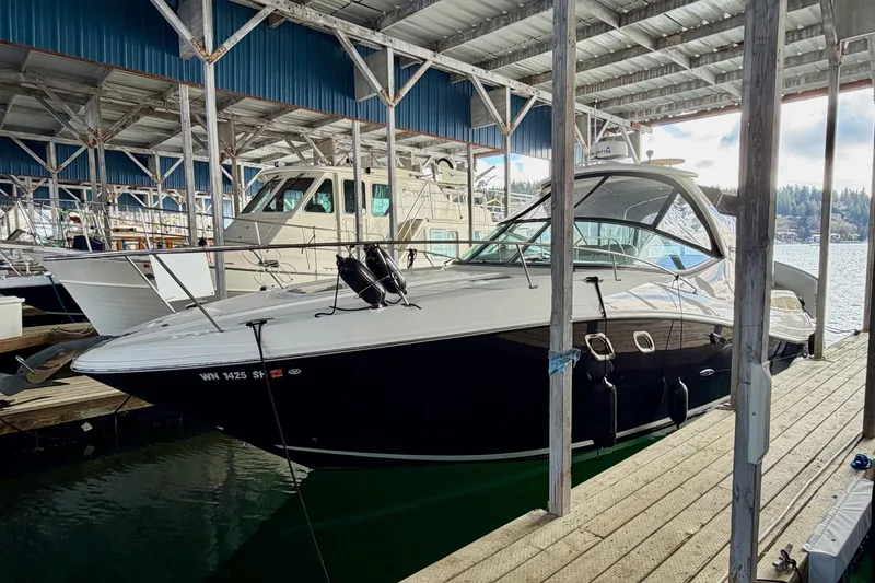 Slide: The Image of 2007 Sea Ray Sundancer 310 docked in a covered marina. - 4