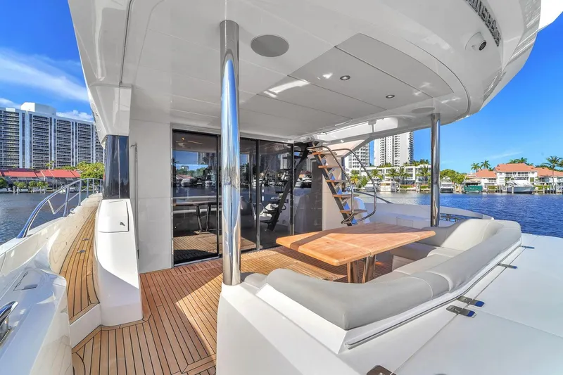 Slide: The Image of Luxury Sunseeker Manhattan 68 yacht interior, 2023 model, with elegant seating and waterfront view. - 36