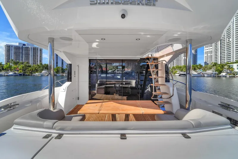 Slide: The Image of 2023 Sunseeker Manhattan 68 yacht deck with city skyline and waterfront view. - 37