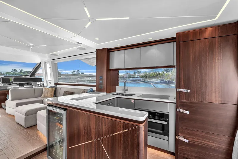 Slide: The Image of Luxurious interior of 2023 Sunseeker Manhattan 68 yacht with modern kitchen and seating area. - 50