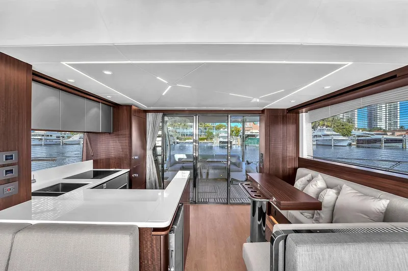 Slide: The Image of Luxurious interior of 2023 Sunseeker Manhattan 68 yacht with modern seating and panoramic windows. - 51
