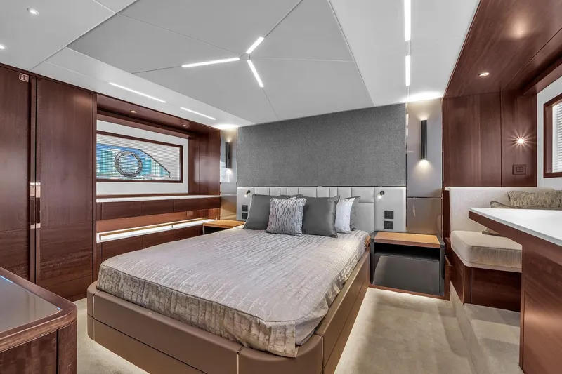 Slide: The Image of Luxurious interior of 2023 Sunseeker Manhattan 68 yacht bedroom with modern design elements. - 70