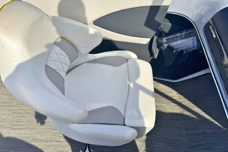 Slide: The Image of 2020 Glastron GTS 200 boat interior with white cushioned seat and modern design. - 10