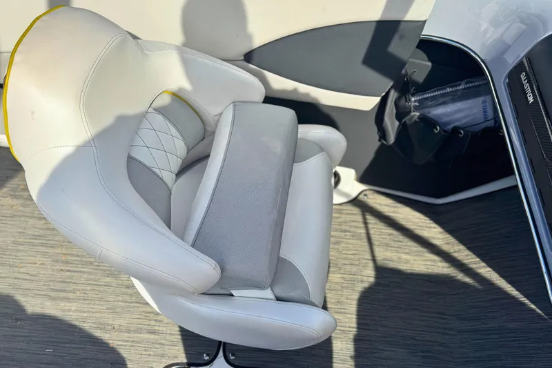Slide: The Image of 2020 Glastron GTS 200 boat interior with white and gray seating. - 11
